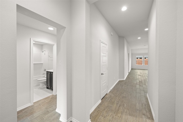 corridor featuring light hardwood / wood-style flooring