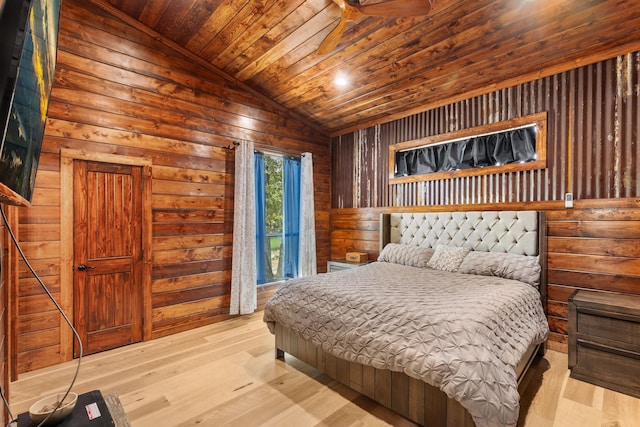 bedroom with light wood-type flooring, vaulted ceiling, and wooden ceiling