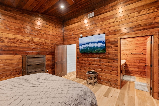 unfurnished bedroom with wood walls, light hardwood / wood-style floors, and wood ceiling