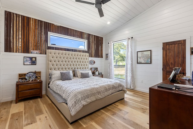 bedroom featuring ceiling fan, light hardwood / wood-style flooring, wooden ceiling, and lofted ceiling