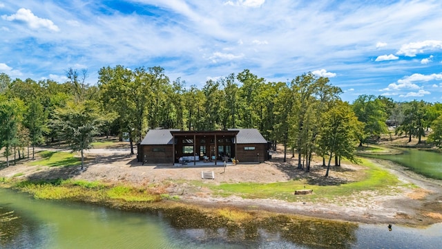 back of house with a water view