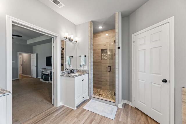 bedroom featuring ceiling fan and light carpet