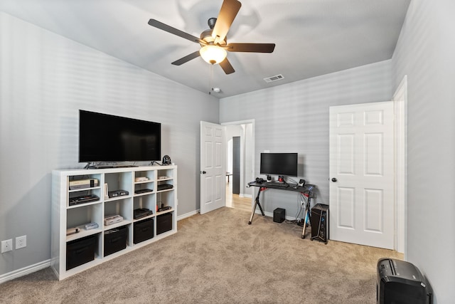 interior space featuring ceiling fan and light colored carpet