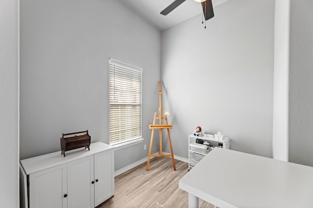 office with ceiling fan, vaulted ceiling, and light wood-type flooring