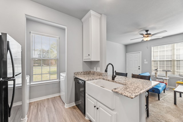 kitchen with ceiling fan, white cabinets, and dishwasher