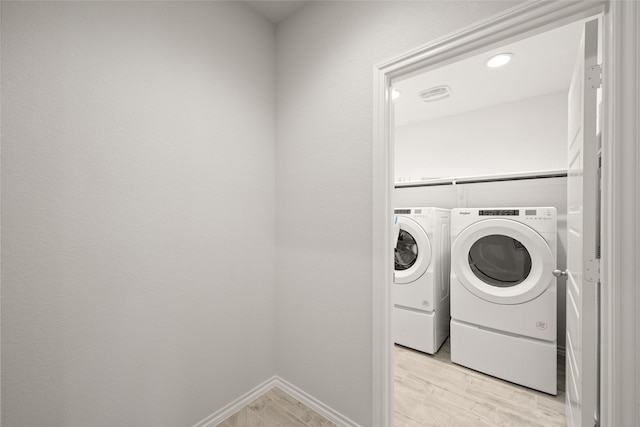 3476 N Crowley Cleburne Rd, Fort Worth, TX 76123 - laundry room with light hardwood / wood-style floors and washer and dryer