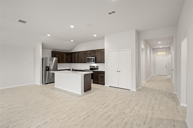 3476 N Crowley Cleburne Rd, Fort Worth, TX 76123 - kitchen featuring an island with sink, appliances with stainless steel finishes, sink, and light wood-type flooring