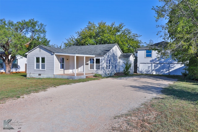 view of front of house with covered porch and a front yard