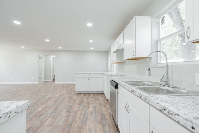 kitchen featuring light wood-type flooring, white cabinetry, sink, and dishwasher