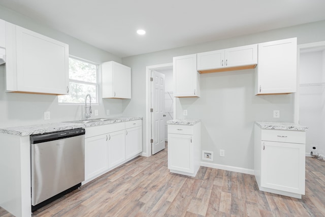 kitchen with light hardwood / wood-style flooring, white cabinets, sink, and stainless steel dishwasher