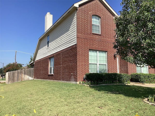 view of home's exterior featuring a yard