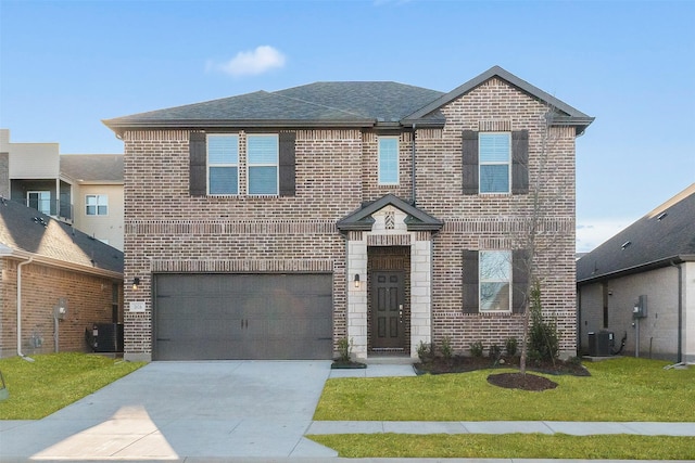 view of front of house with central AC, a garage, and a front yard