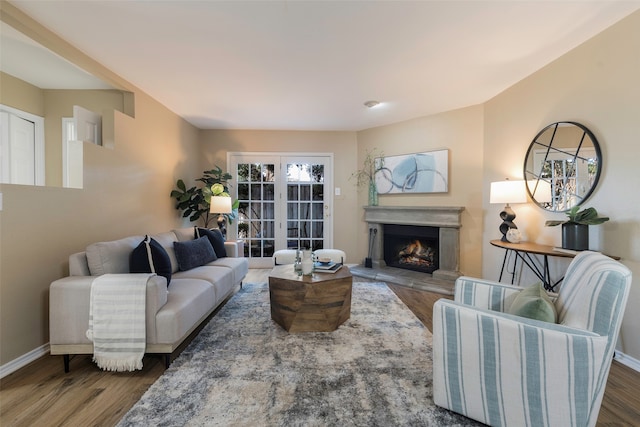 living room with dark hardwood / wood-style floors and french doors