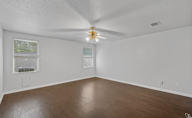 spare room featuring hardwood / wood-style flooring, a textured ceiling, and ceiling fan