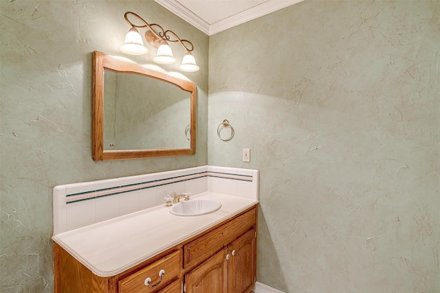 bathroom with ornamental molding and vanity