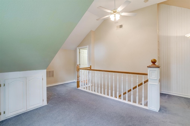 bonus room with carpet floors, vaulted ceiling, and ceiling fan