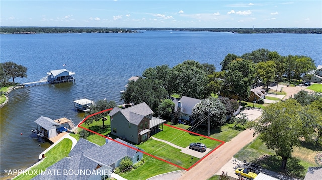 birds eye view of property with a water view