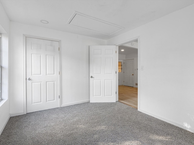 unfurnished bedroom featuring a closet and carpet