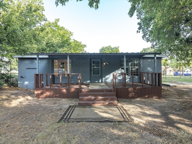 back of house with covered porch