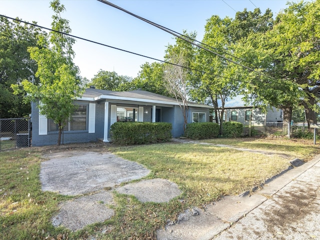 ranch-style home with a front lawn