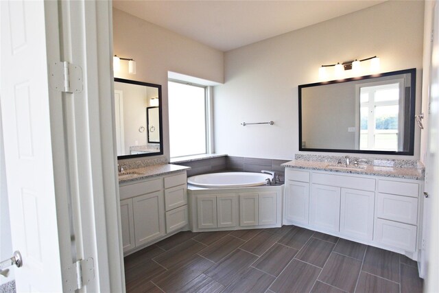 168 Falcon Point Dr, Heath, TX 75032 - bathroom featuring a bathing tub and vanity