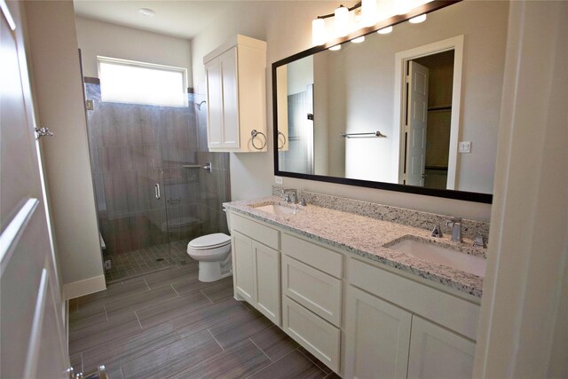 168 Falcon Point Dr, Heath, TX 75032 - bathroom featuring toilet, an enclosed shower, and vanity