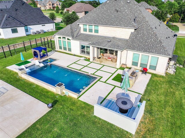 168 Falcon Point Dr, Heath, TX 75032 - view of swimming pool featuring a patio, a fire pit, a yard, and pool water feature