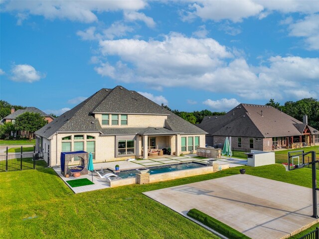 168 Falcon Point Dr, Heath, TX 75032 - back of house featuring a swimming pool with hot tub, a patio, and a lawn