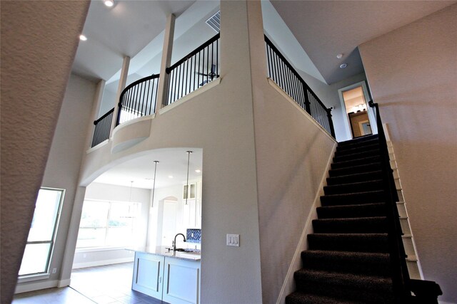 168 Falcon Point Dr, Heath, TX 75032 - stairs featuring sink and a high ceiling