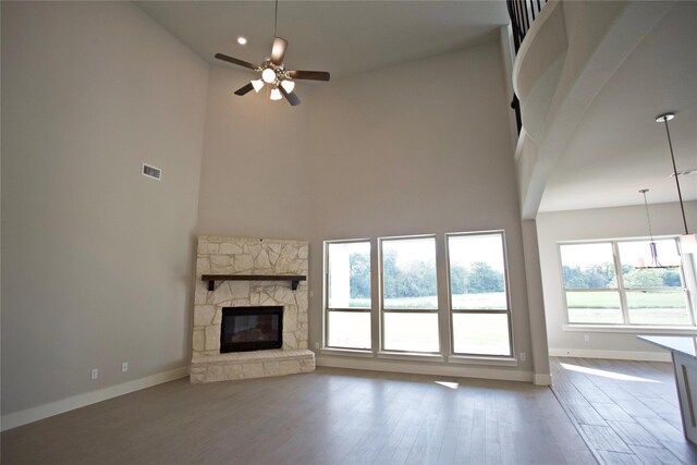168 Falcon Point Dr, Heath, TX 75032 - unfurnished living room with hardwood / wood-style floors, a high ceiling, and ceiling fan