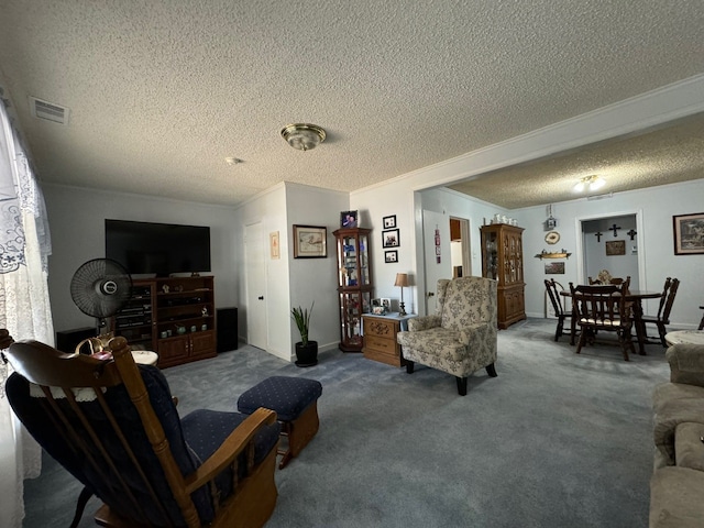 carpeted living room with ornamental molding and a textured ceiling