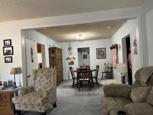 living room with carpet floors, ornamental molding, and a textured ceiling