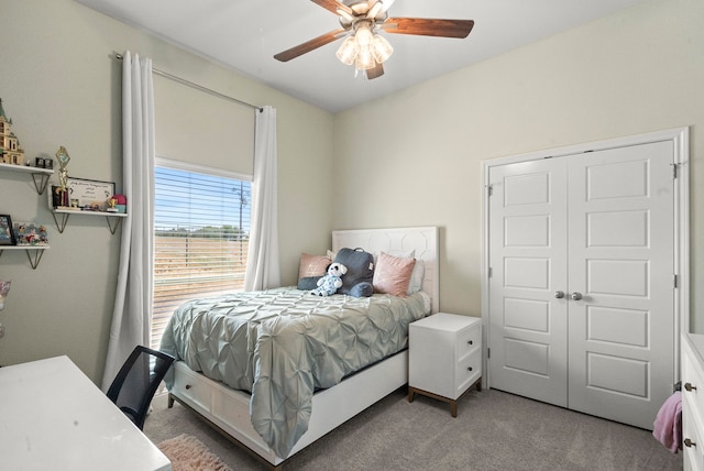 carpeted bedroom with a closet and ceiling fan