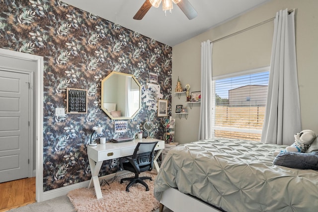 bedroom featuring ceiling fan and carpet