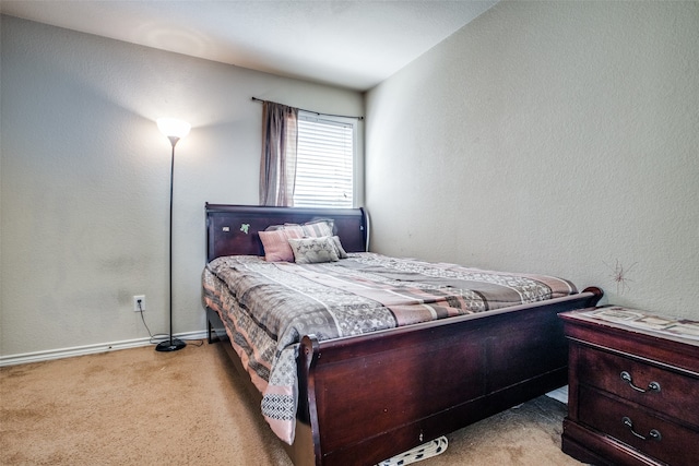 bedroom with light carpet