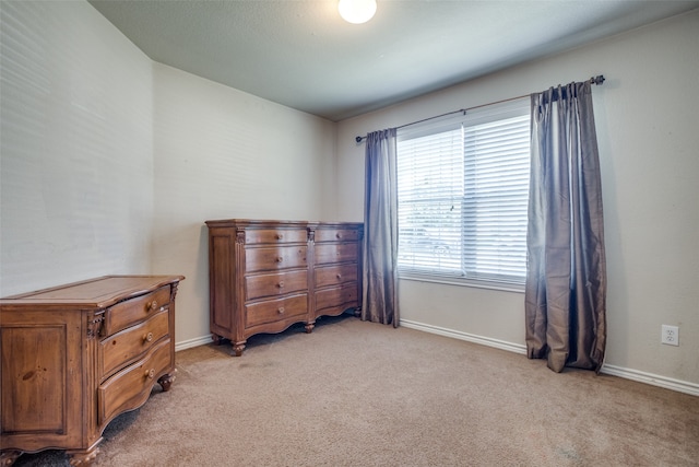 bedroom with light carpet