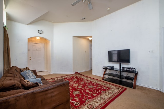 carpeted living room with ceiling fan