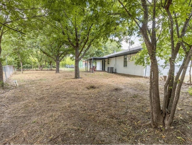 rear view of house with outdoor lounge area, a patio, and a lawn