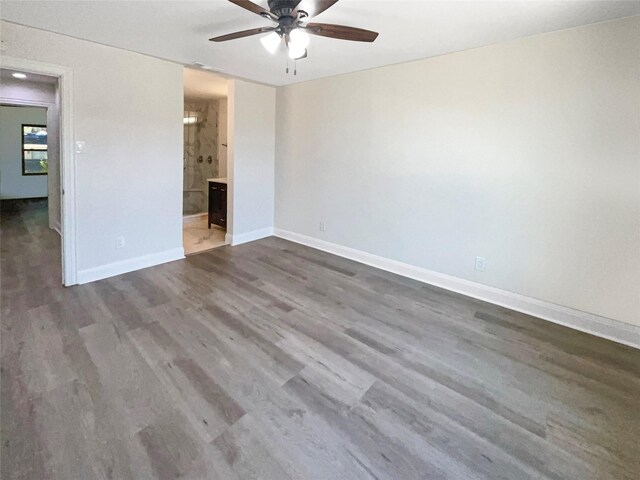 unfurnished bedroom featuring ceiling fan, hardwood / wood-style flooring, and ensuite bathroom