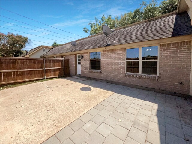 rear view of house with a patio