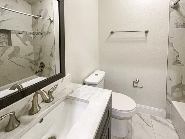 full bathroom with tile patterned flooring, tiled shower / bath, toilet, and vanity