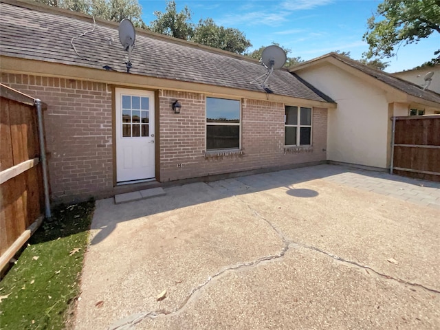 back of property featuring a patio