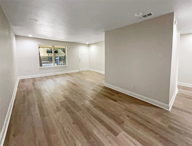 unfurnished living room featuring hardwood / wood-style floors