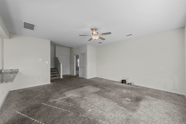 spare room featuring carpet flooring and ceiling fan