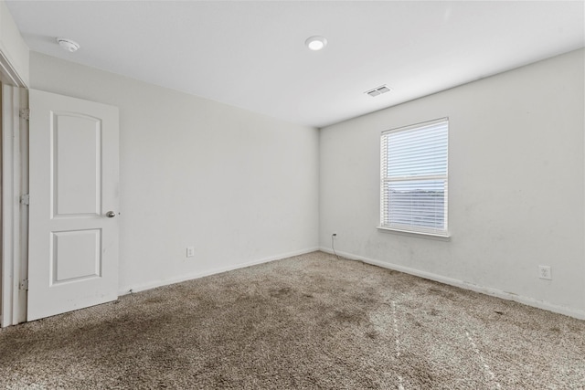 spare room featuring carpet floors