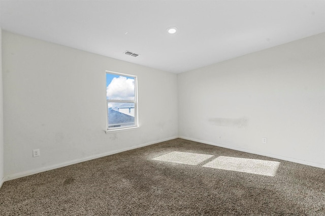empty room with recessed lighting, carpet, visible vents, and baseboards