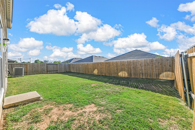 view of yard featuring a fenced backyard and cooling unit