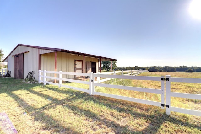 exterior space with a rural view and an outdoor structure