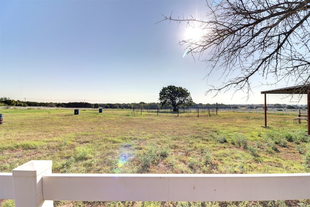 view of yard with a rural view