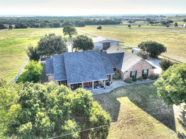 birds eye view of property with a rural view